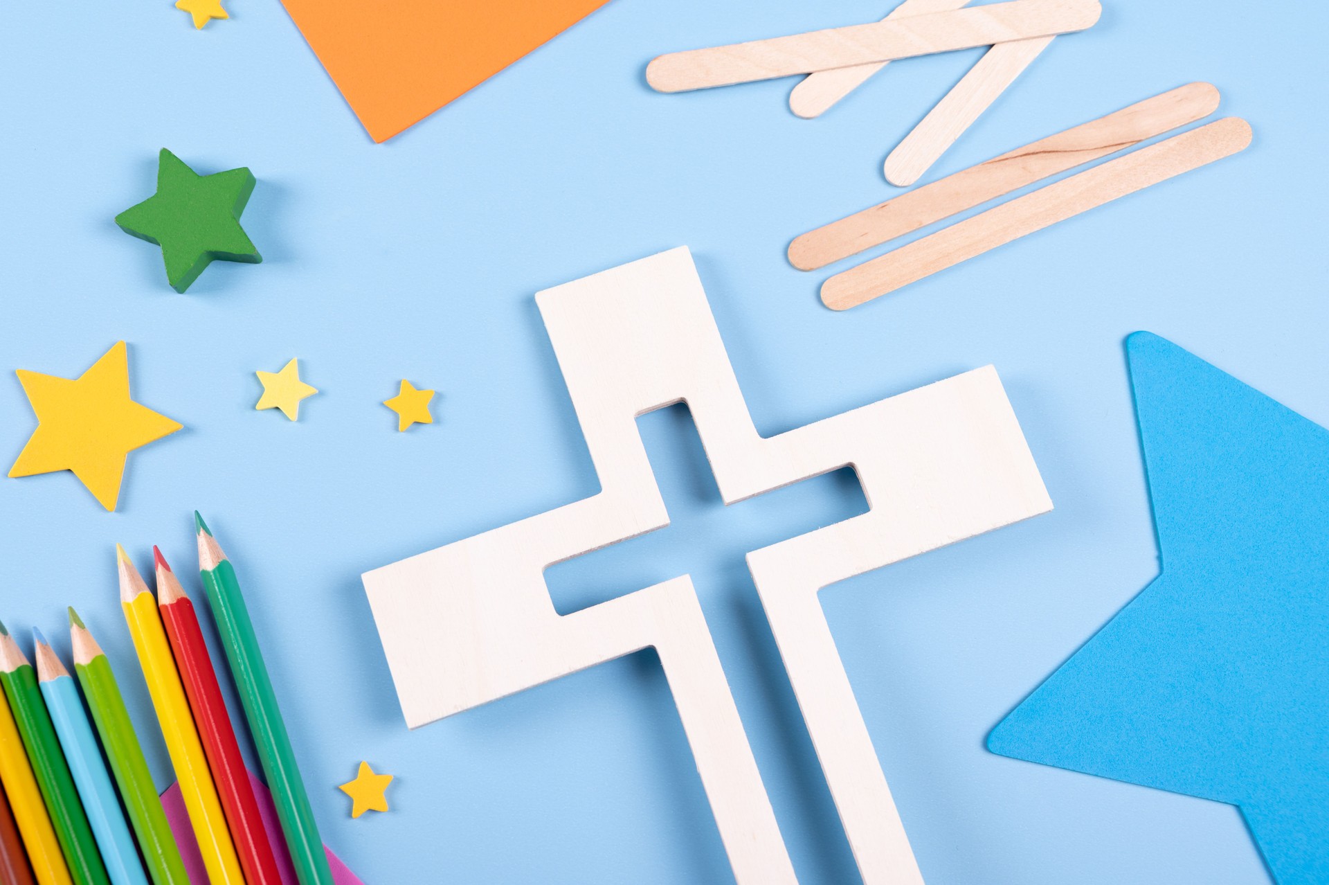 Vacation Bible School craft supply with wooden cross. Christian concept.